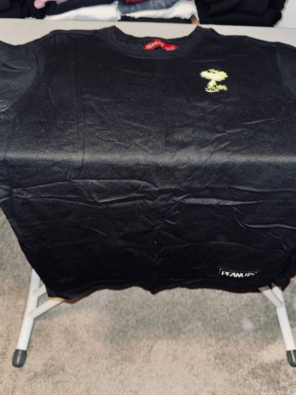 Peanuts Black Tee with Yellow Woodstock Chest Graphic